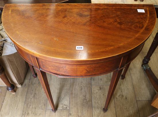 An Edwardian demi lune card table, W.92cm